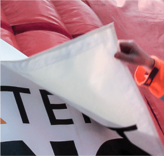 Removeable banner being removed from side of Fast Tent