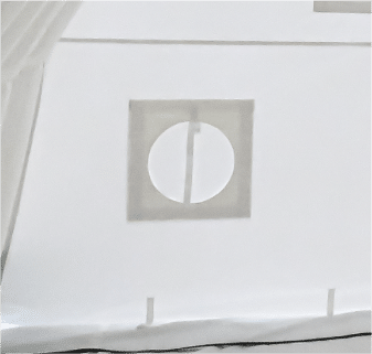 Ducting hole in end wall of the tent