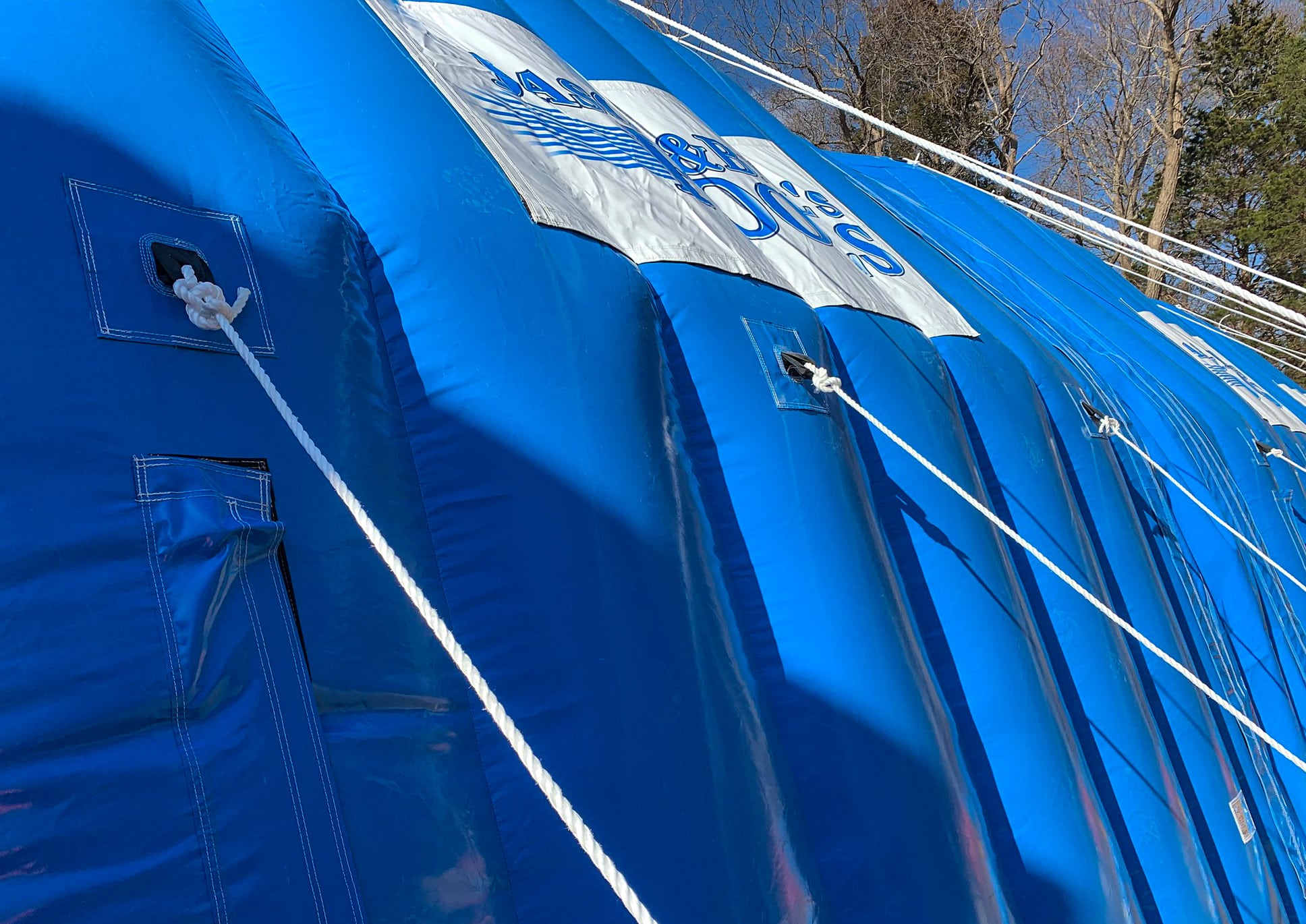 Side view of blue CA-12 Fast Tent showing anchor ropes