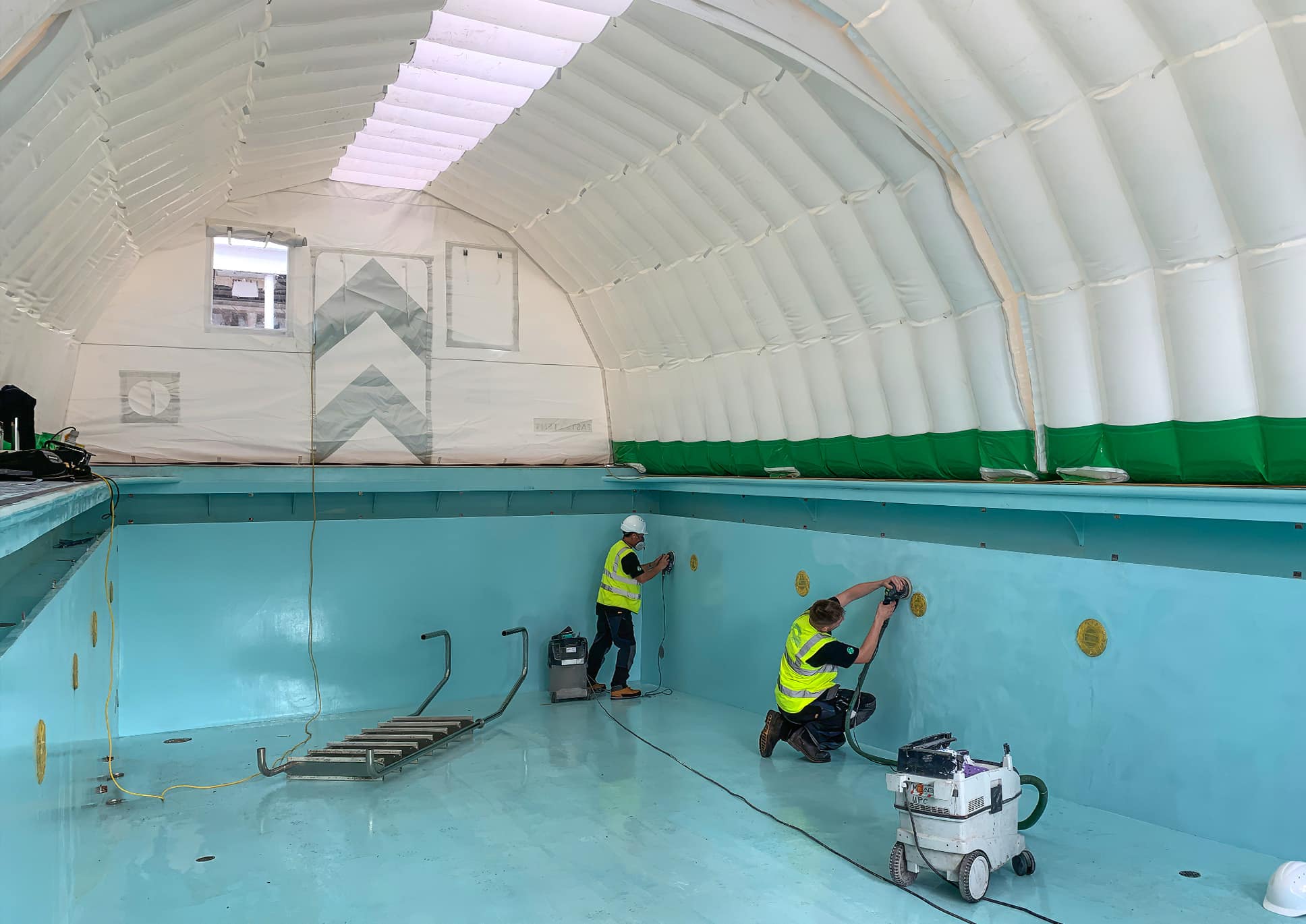 White CA-6 Fast Tent set up over swimming pool